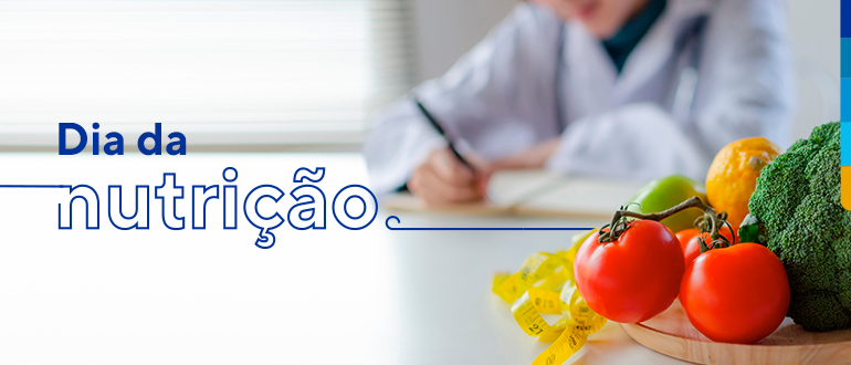 Texto: Dia da nutrição,. Ao lado, prato com tomates, brócolis, limão siciliano e maçã verde
