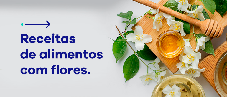 Texto: Receitas de alimentos com flores. Ao lado, imagem com flores brancas sobre mesa de madeira e com pote de mel