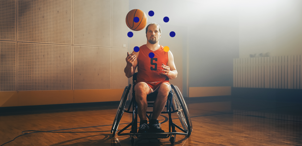 homem em uma cadeira de rodas, jogando uma bola de basquete para cima. Simbolizando o dia Internacional das pessoas com deficiência