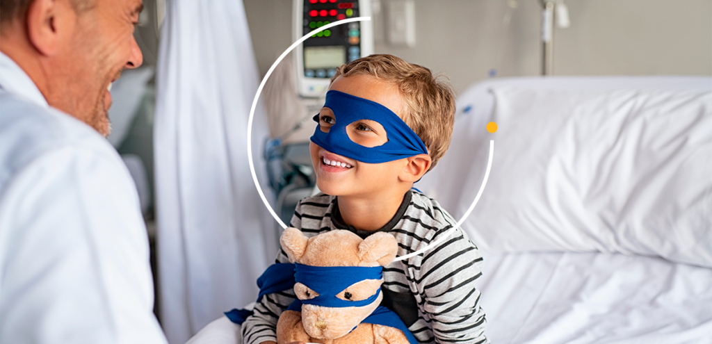 Imagem de um homem e uma criança, remetendo a um médico e paciente infantil em um leito de hospital, simbolizando setembro dourado